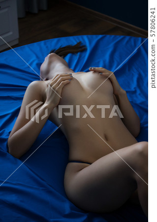 Topless female in panties lying on bed - Stock Photo [78013384] - PIXTA