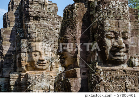 Smiling Faces of Bayon Temple in Angkor Thom is The Heritage of Khmer Empire at Siem Reap Province, Cambodia. Smiling Faces of Bayon Temple in Angkor Thom is The Heritage of Khmer Empire at Siem Reap Province, Cambodia. 57806401