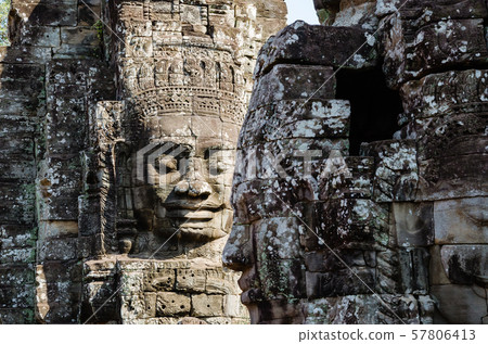 Smiling Faces of Bayon Temple in Angkor Thom is The Heritage of Khmer Empire at Siem Reap Province, Cambodia. 57806413