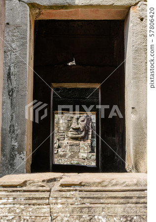 Smiling Faces of Bayon Temple in Angkor Thom is The Heritage of Khmer Empire at Siem Reap Province, Cambodia. Smiling Faces of Bayon Temple in Angkor Thom is The Heritage of Khmer Empire at Siem Reap Province, Cambodia. 57806420