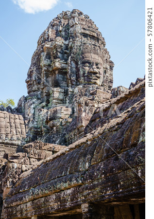 Smiling Faces of Bayon Temple in Angkor Thom is The Heritage of Khmer Empire at Siem Reap Province, Cambodia. 57806421