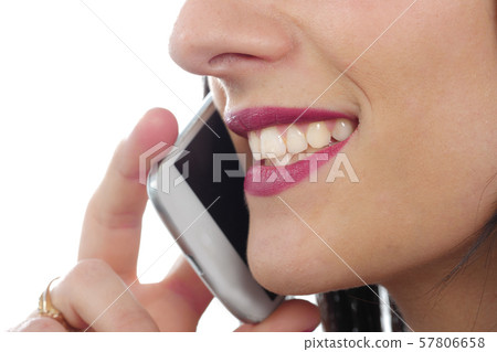 Close up of young attractive woman talking on the Close up of young attractive woman talking on the 57806658