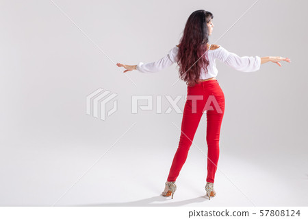 Latin dance, bachata lady, jazz modern and vogue dance concept - Beautiful young woman dancing on 57808124