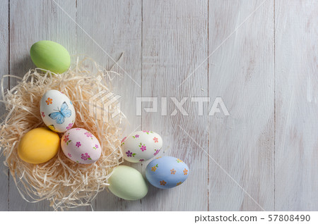 Easter painted eggs on wooden background Easter painted eggs on wooden background 57808490