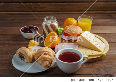 Breakfast with tea, orange juise and croissant Breakfast with tea, orange juise and croissant 57808497