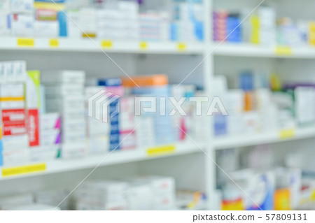 Medicine on shelves in Pharmacy interior with blurred background 57809131