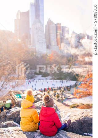 Adorable little girls in Central Park at New York City Adorable little girls in Central Park at New York City 57809310