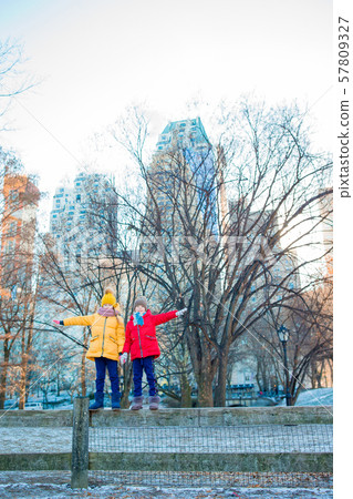 Adorable little girls in Central Park at New York City 57809327