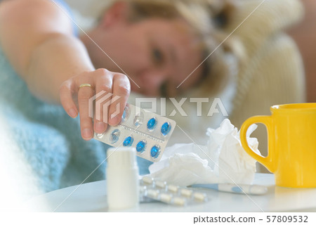 Mature woman suffering from flu or cold Mature woman suffering from flu or cold 57809532