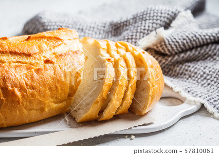 Sliced wheat bread on the white board. 57810061