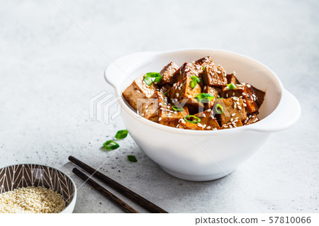 Teriyaki tofu with sesame seeds and green onion  57810066