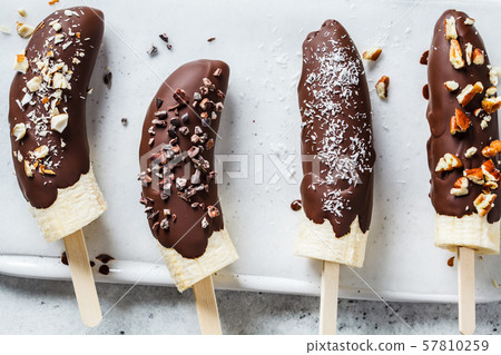 Vegan dessert for kids. Banana in dark chocolate Vegan dessert for kids. Banana in dark chocolate 57810259