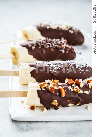 Vegan dessert for kids. Banana in dark chocolate Vegan dessert for kids. Banana in dark chocolate 57810265