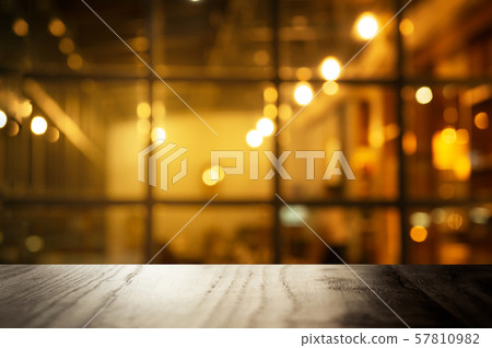top of black table counter with blur window of blur pub or bar with party night light interior background 57810982
