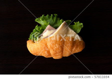 isolated ham and chess and green vegetable bread croissant breakfast food on black background isolated ham and chess and green vegetable bread croissant breakfast food on black background 57811034