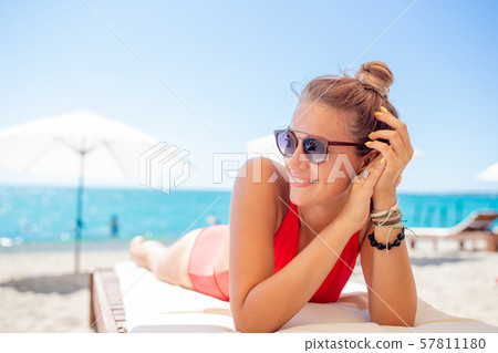 Outdoor portrait of woman on the beach. Outdoor portrait of woman on the beach. 57811180