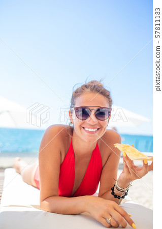Outdoor portrait of woman on the beach. Outdoor portrait of woman on the beach. 57811183