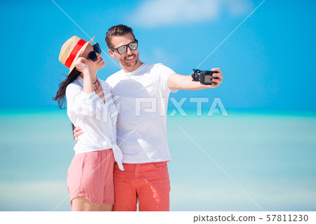 Family of two have fun on the beach Family of two have fun on the beach 57811230