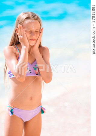 Cute little girl at beach during summer vacation 57812893