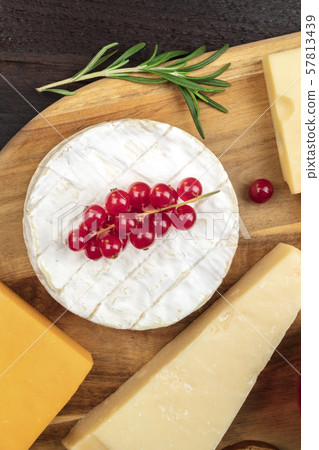 Camembert cheese, overhead shot with other cheeses and fruit 57813439