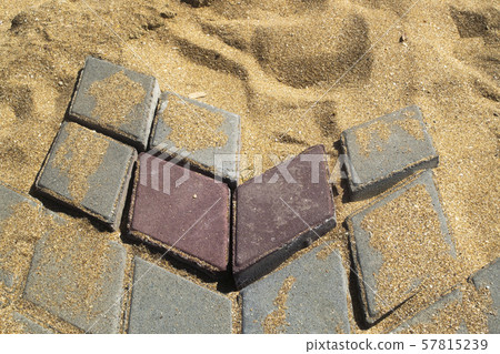 Destroyed path of paving stone on a sandy base Destroyed path of paving stone on a sandy base 57815239