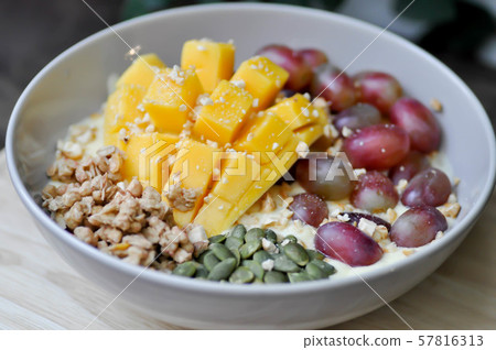 smoothie bowl, mango yogurt with fruit topping smoothie bowl, mango yogurt with fruit topping 57816313