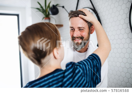 Mature father with small in the bathroom in the morning, talking. 57816588