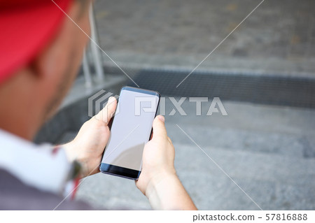 Stylish guy with smartphone outdoor 57816888