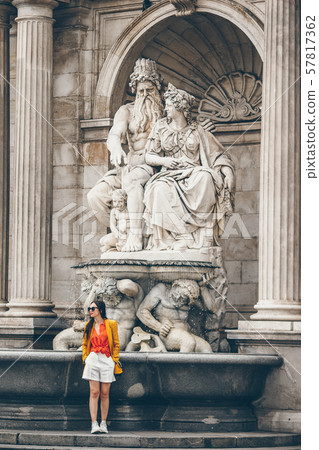 Woman walking in city. Young attractive tourist outdoors in italian city Woman walking in city. Young attractive tourist outdoors in italian city 57817362