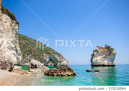 Mattinata Faraglioni stacks and beach coast of Mergoli, Vieste Gargano, Apulia, Italy. Mattinata Faraglioni stacks and beach coast of Mergoli, Vieste Gargano, Apulia, Italy. 57818064