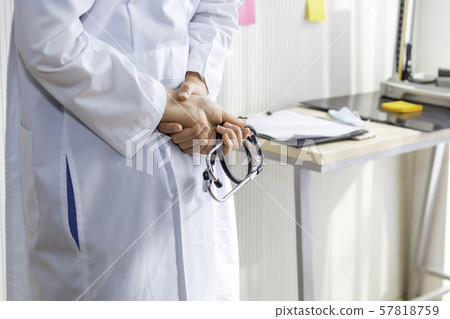 Hand holding a stethoscope on background. 57818759