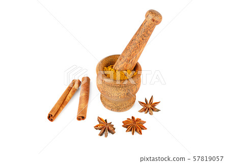 Mortar and pestle, cinnamon and star anise on 57819057