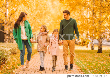 Portrait of happy family of four in autumn day 57819116