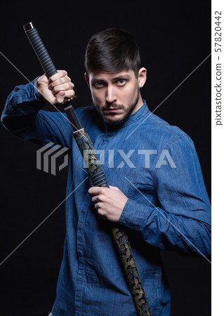 Attractive young man posing in studio 57820442