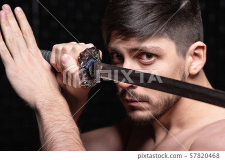 Portrait of handsome guy posing in studio 57820468