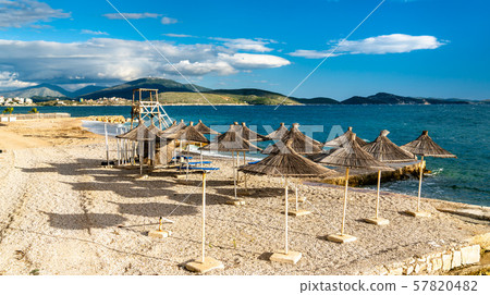 Straw umbrellas on a beach in Saranda, Albania Straw umbrellas on a beach in Saranda, Albania 57820482