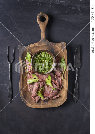 board with sliced roast beef  57821103