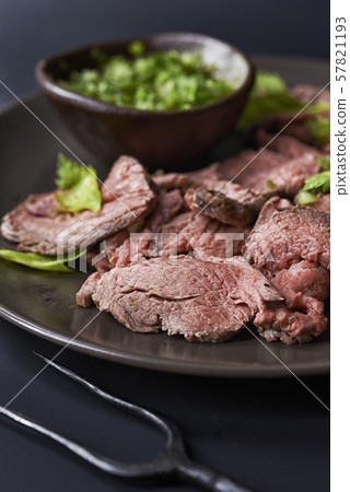 plate with sliced roast beef 57821193