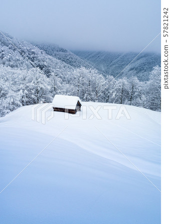 Wooden hut in a fairy tale winter landscape Wooden hut in a fairy tale winter landscape 57821242