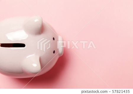 Pink piggy bank isolated on pink background Pink piggy bank isolated on pink background 57821435