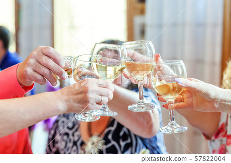 Hands holding glasses of champagne and wine making Hands holding glasses of champagne and wine making 57822004