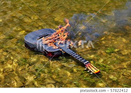 They set the guitar on fire and put it in water. 57822412