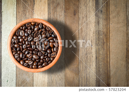 top view of roast Coffee Beans in a cup on wooden top view of roast Coffee Beans in a cup on wooden 57823204