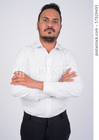 Studio shot of bearded Indian businessman with arms crossed 57826491