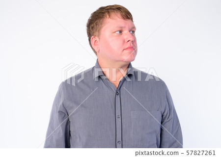 Face of overweight businessman thinking and looking up Face of overweight businessman thinking and looking up 57827261