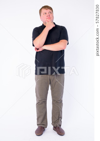 Full body shot of overweight man thinking and looking up 57827830
