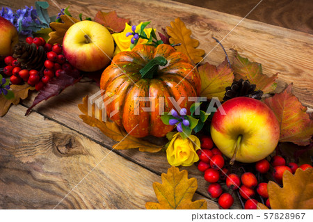 Fall wreath with pumpkin, purple flowers, apples 57828967