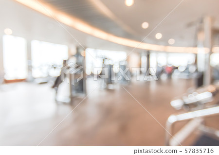 Blur gym background fitness center or health club with blurry sports exercise equipment for aerobic workout and bodybuilding 57835716