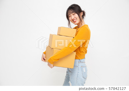 Happy Chinese Asian woman holding package parcel box 57842127
