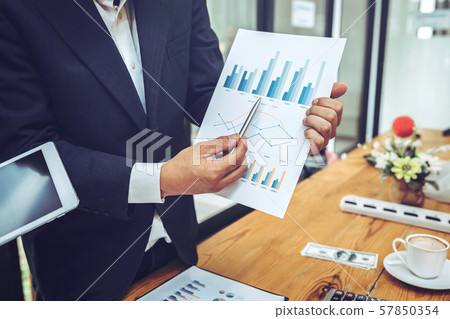 Company employees using tablet with business Company employees using tablet with business 57850354